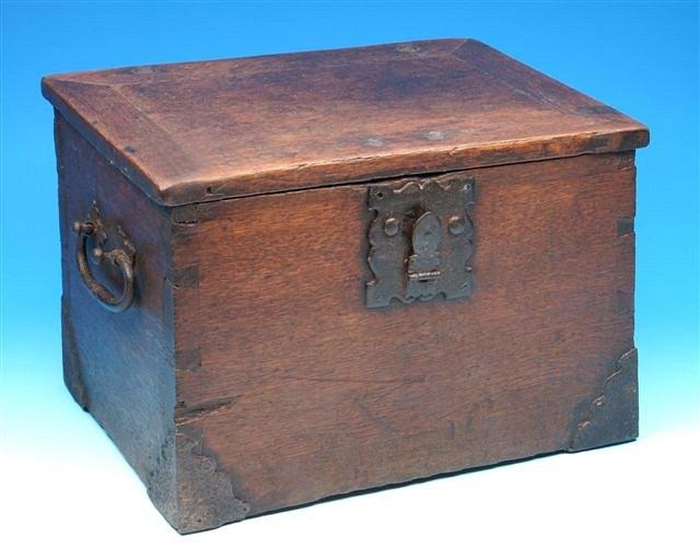 Appraisal: A possibly th Century oak casket with iron lock carrying