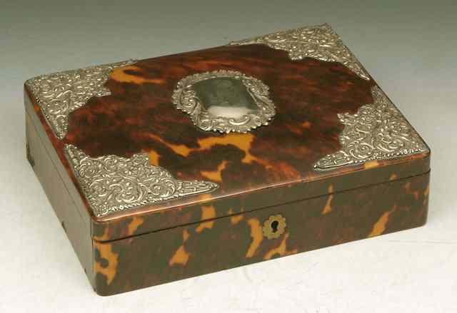 Appraisal: A TORTOISE SHELL JEWELLERY BOX WITH HINGED LID with applied