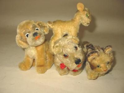 Appraisal: Four small Steiff items all covered in plush comprising tabby