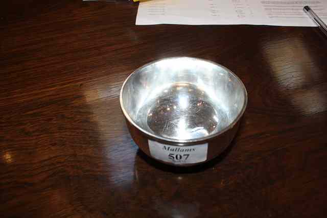 Appraisal: A PLAIN TURNED SILVER BOWL on a stepped foot wide