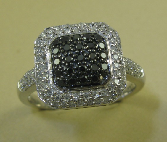 Appraisal: BLACK DIAMOND AND WHITE GOLD RING k gold set with