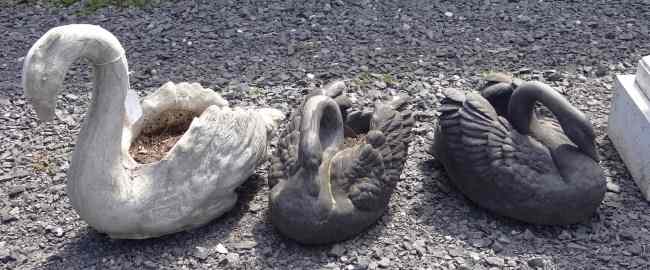 Appraisal: Lot three swan planters two composition one cement