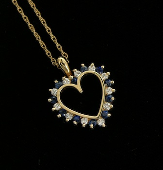 Appraisal: A Sapphire and Diamond Heart Pendant Cowell Hubbard k yellow