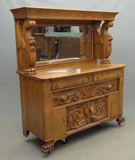 Appraisal: Victorian carved oak server with mirror having carved Griffon supports