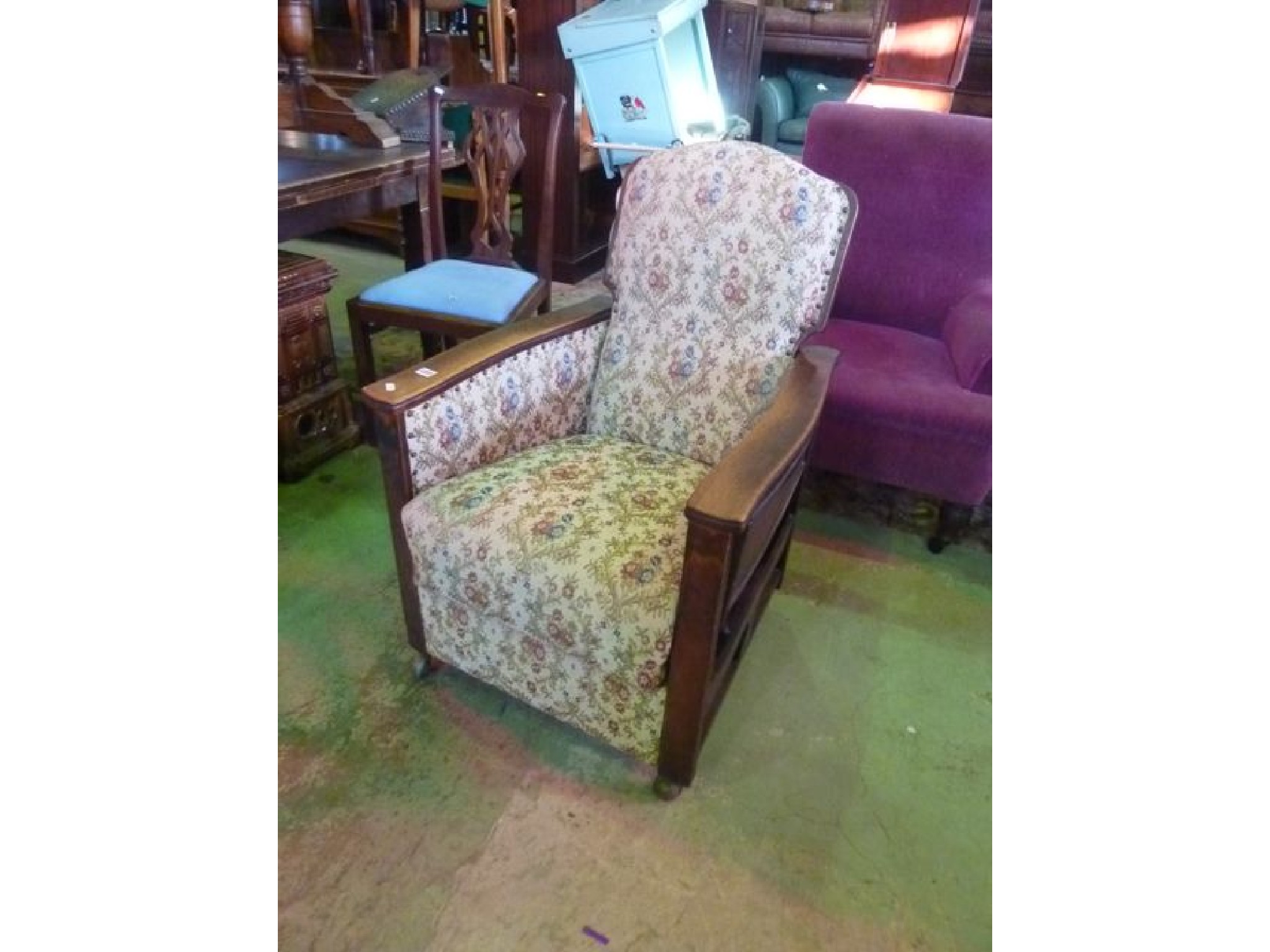 Appraisal: A s oak framed reclining armchair with floral upholstered seat