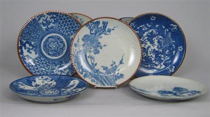 Appraisal: Seven blue and white chargers With blue underglaze floral and