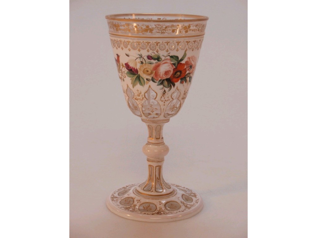 Appraisal: A Victorian Bohemian overlay glass goblet the raised white decoration