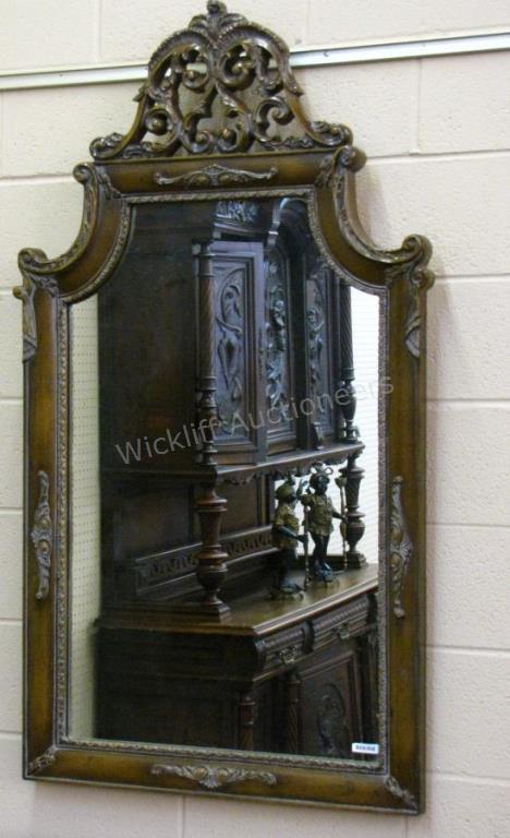 Appraisal: A French period-style wall mirror with carved and scroll decoration