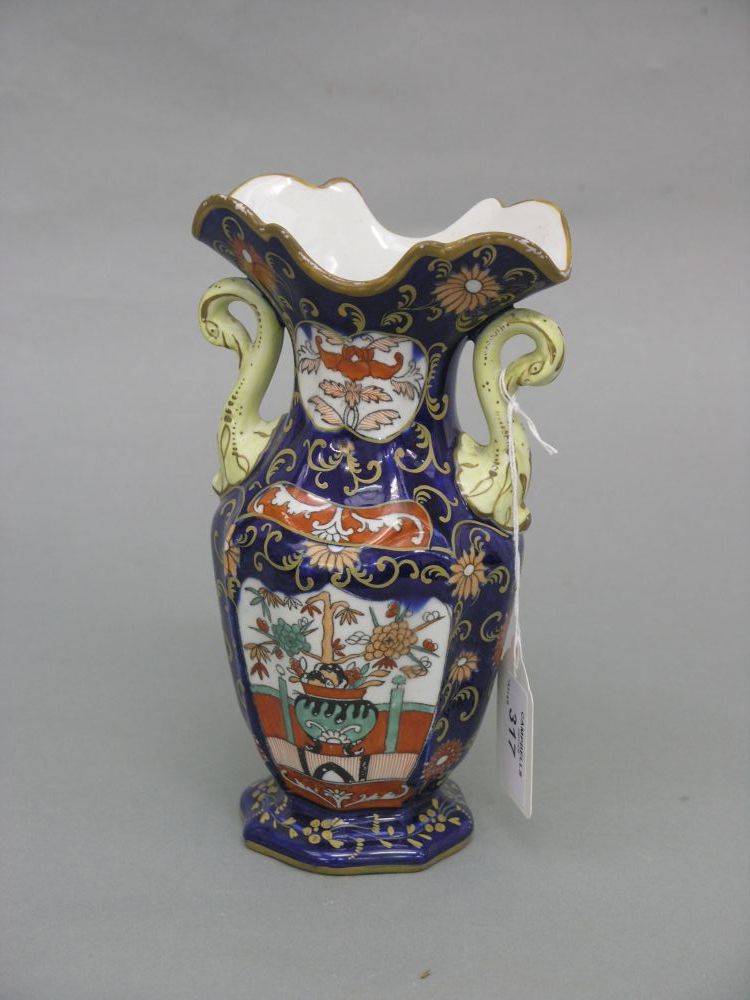 Appraisal: A Mason's ironstone vase with swan neck handles printed and