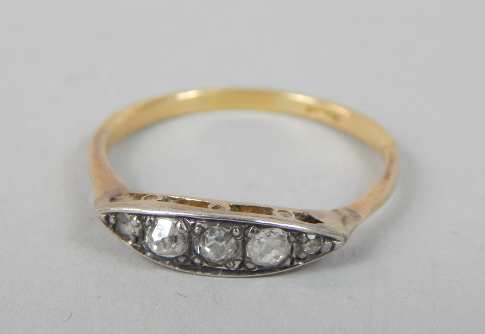 Appraisal: An Art Deco dress ring set with five diamonds yellow