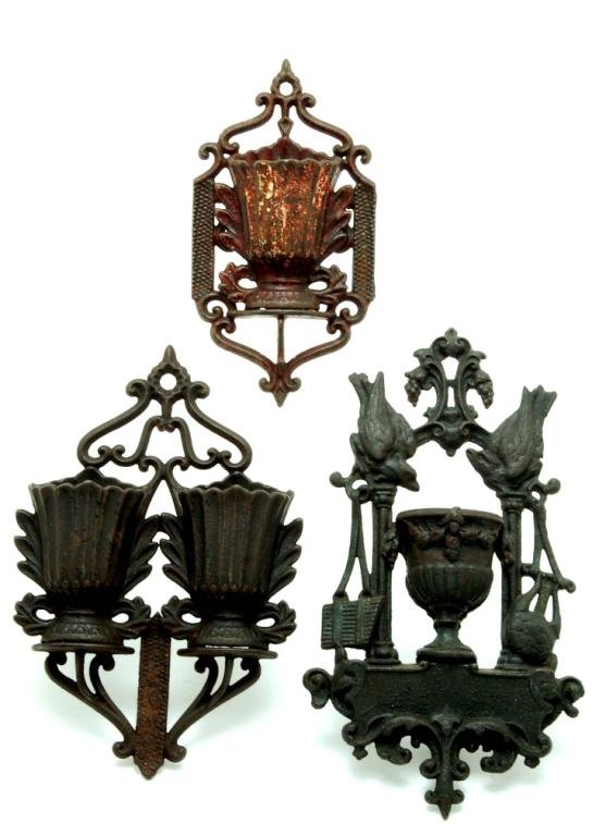 Appraisal: Three cast iron urn form hanging metal match safes MEASUREMENTS