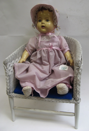 Appraisal: AN EARLY COMPOSITION DOLL AND WHITE PAINTED WICKER DOLL CHAIR