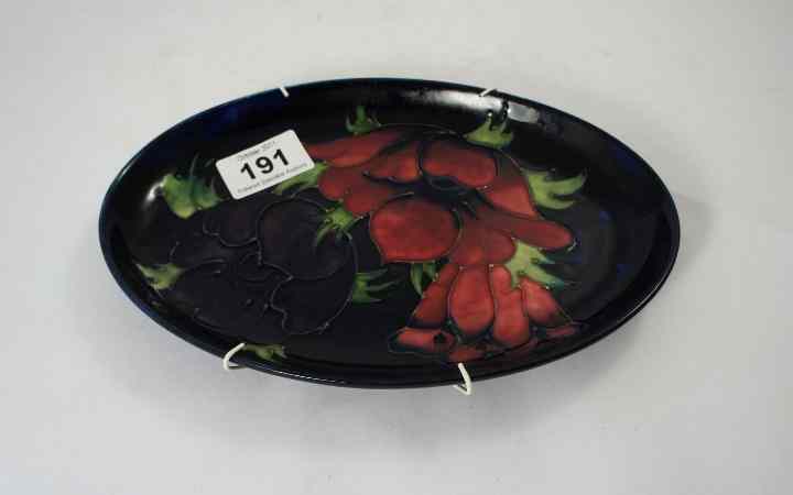 Appraisal: Moorcroft Oval Dish decorated with Poppies on blue length cm