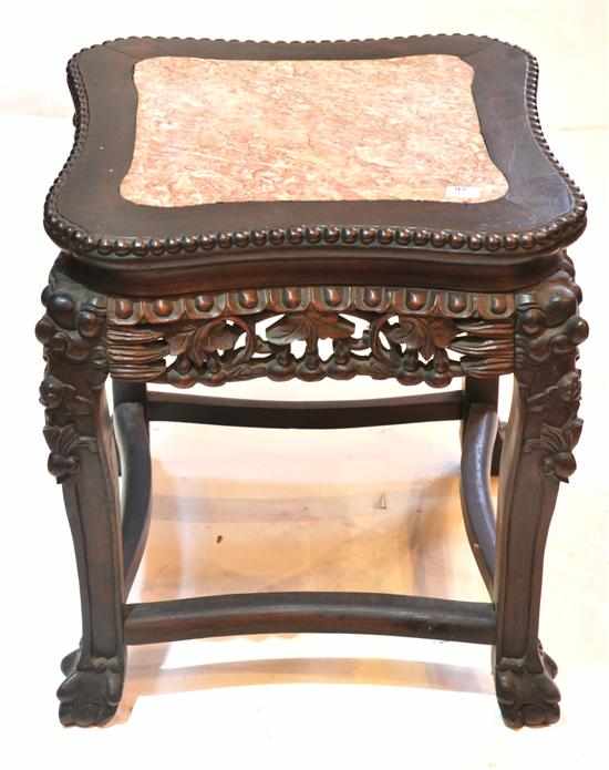 Appraisal: A Chinese rosewood pedestal The rectangular marble inset top above