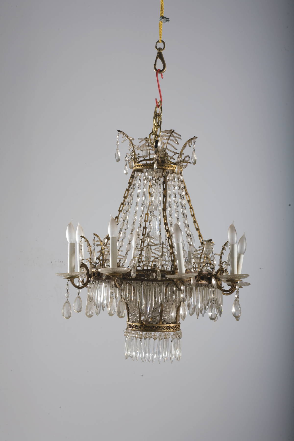 Appraisal: EMPIRE STYLE CUT-GLASS AND GILT-METAL EIGHT-LIGHT CHANDELIER Of cage form