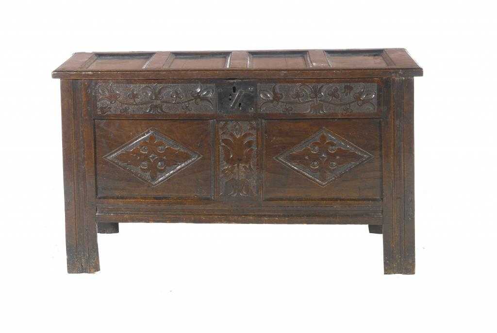 Appraisal: A CHARLES II OAK CHEST with four panel lid the