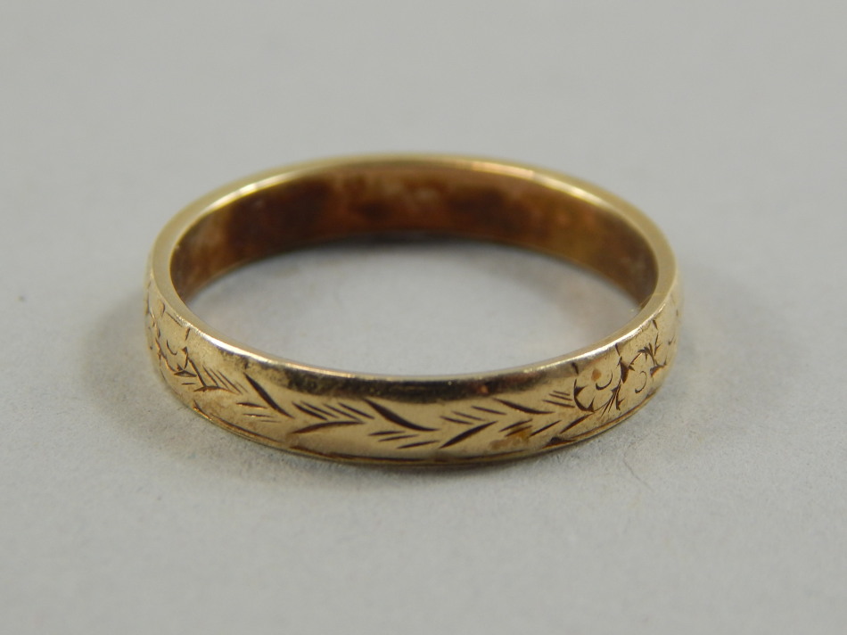 Appraisal: A ct gold wedding band with florally engraved design g