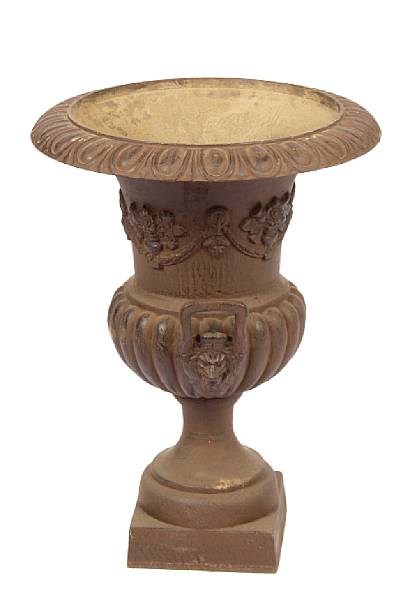 Appraisal: A set of four cast iron planters height in diameter