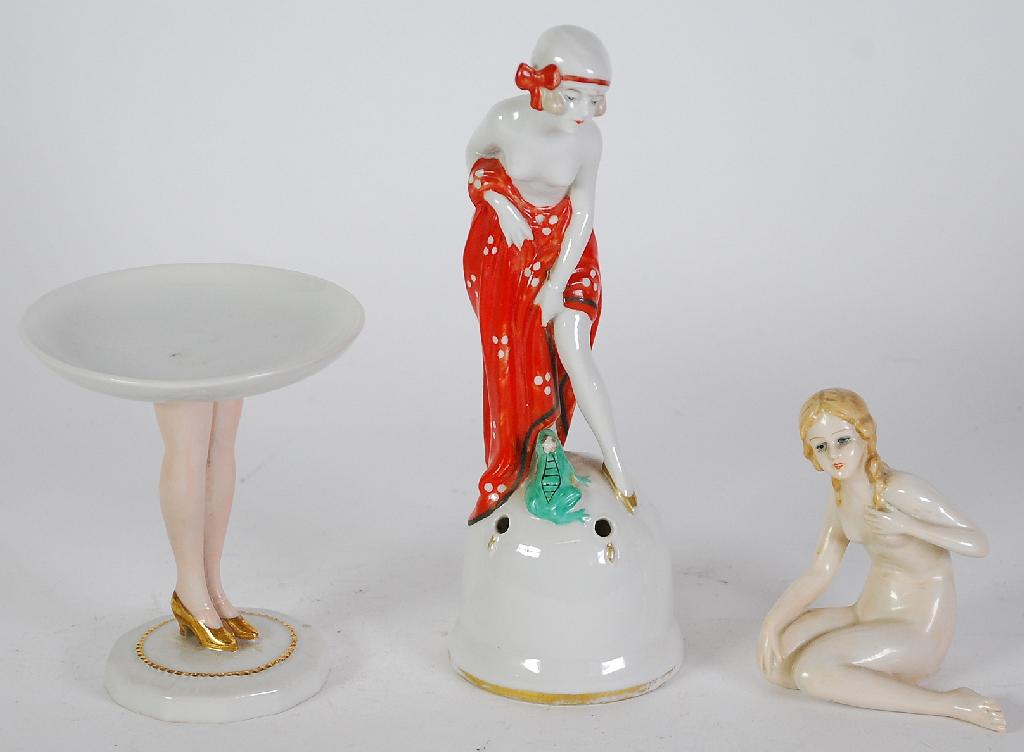 Appraisal: ART DECO GERMAN PORCELAIN FIGURAL HAT PIN HOLDER modelled as