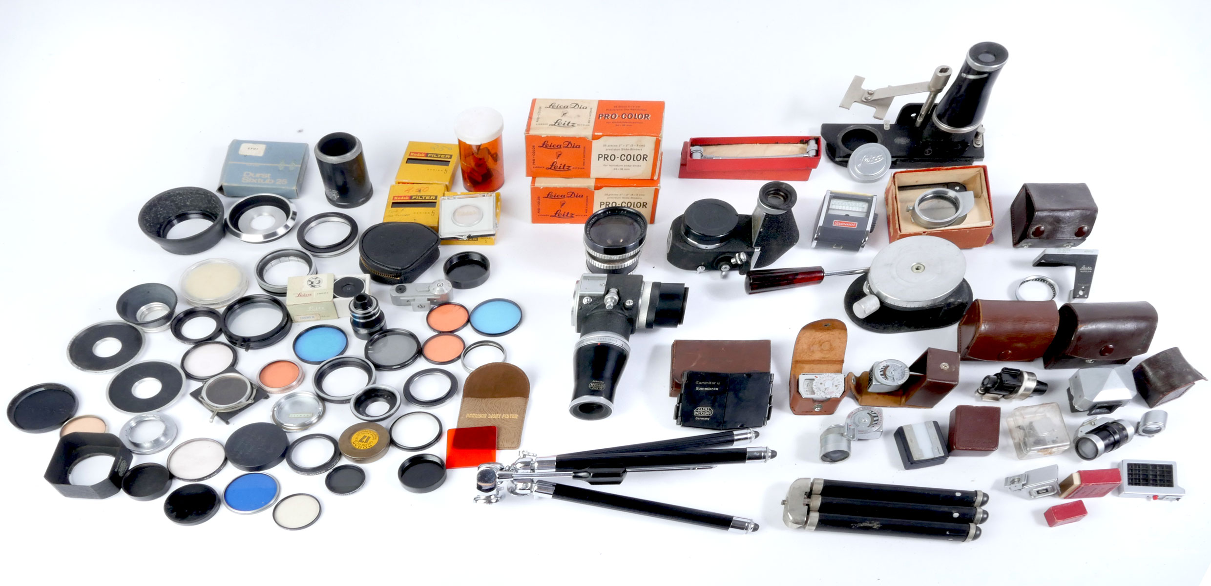 Appraisal: LARGE COLLECTION OF CAMERA LENSES ACCESSORIES Comprising Tripods filters lenses