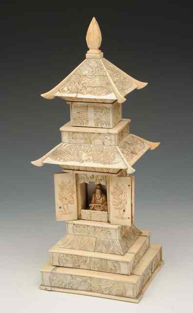 Appraisal: A JAPANESE IVORY CARVED PAGODA of tiered form with central