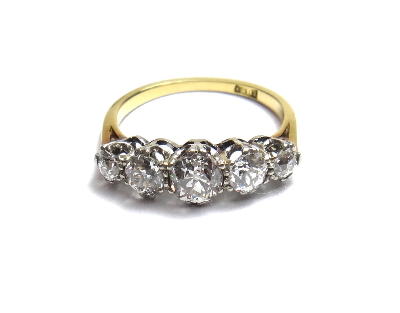 Appraisal: A gold and diamond set five stone ring claw set