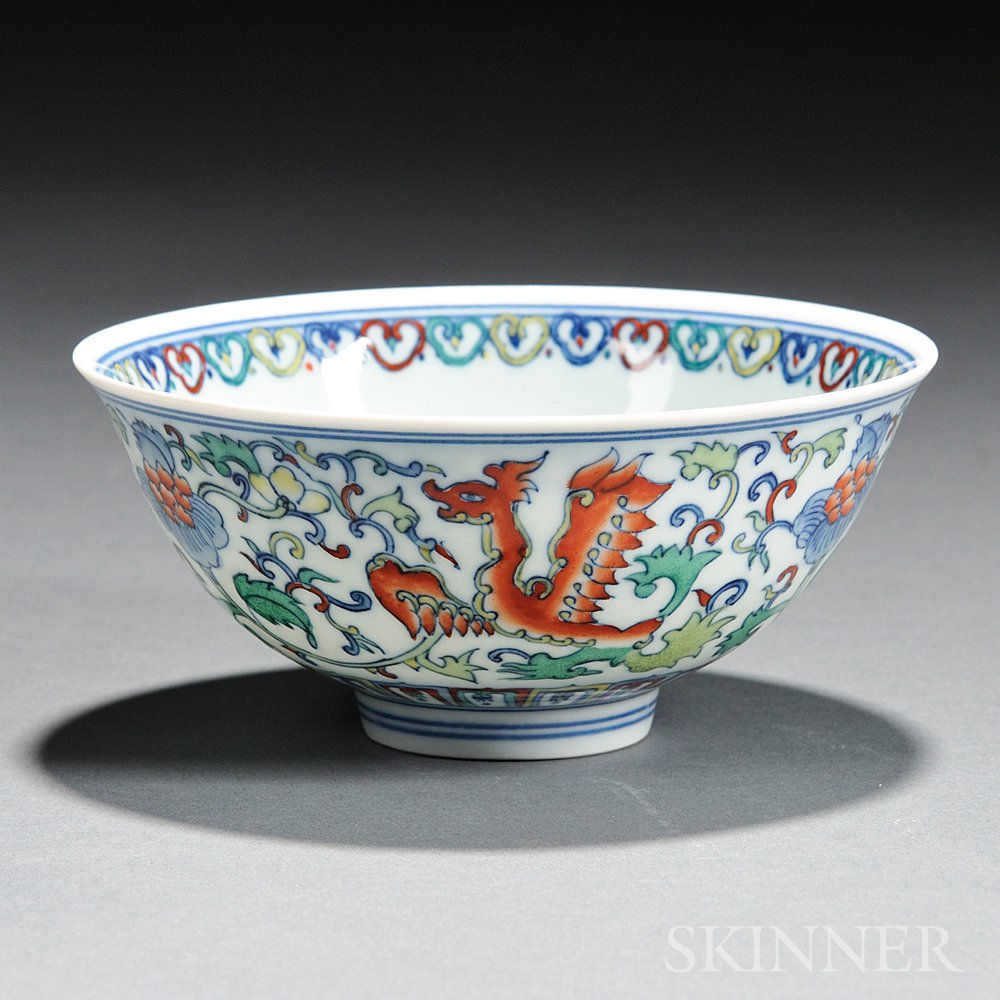 Appraisal: Doucai Bowl China decorated with stylized dragon and lotus scroll