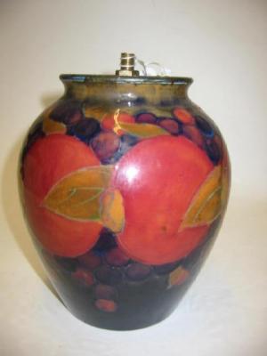 Appraisal: A WILLIAM MOORCROFT BURSLEM POTTERY VASE in the Pomegranate pattern