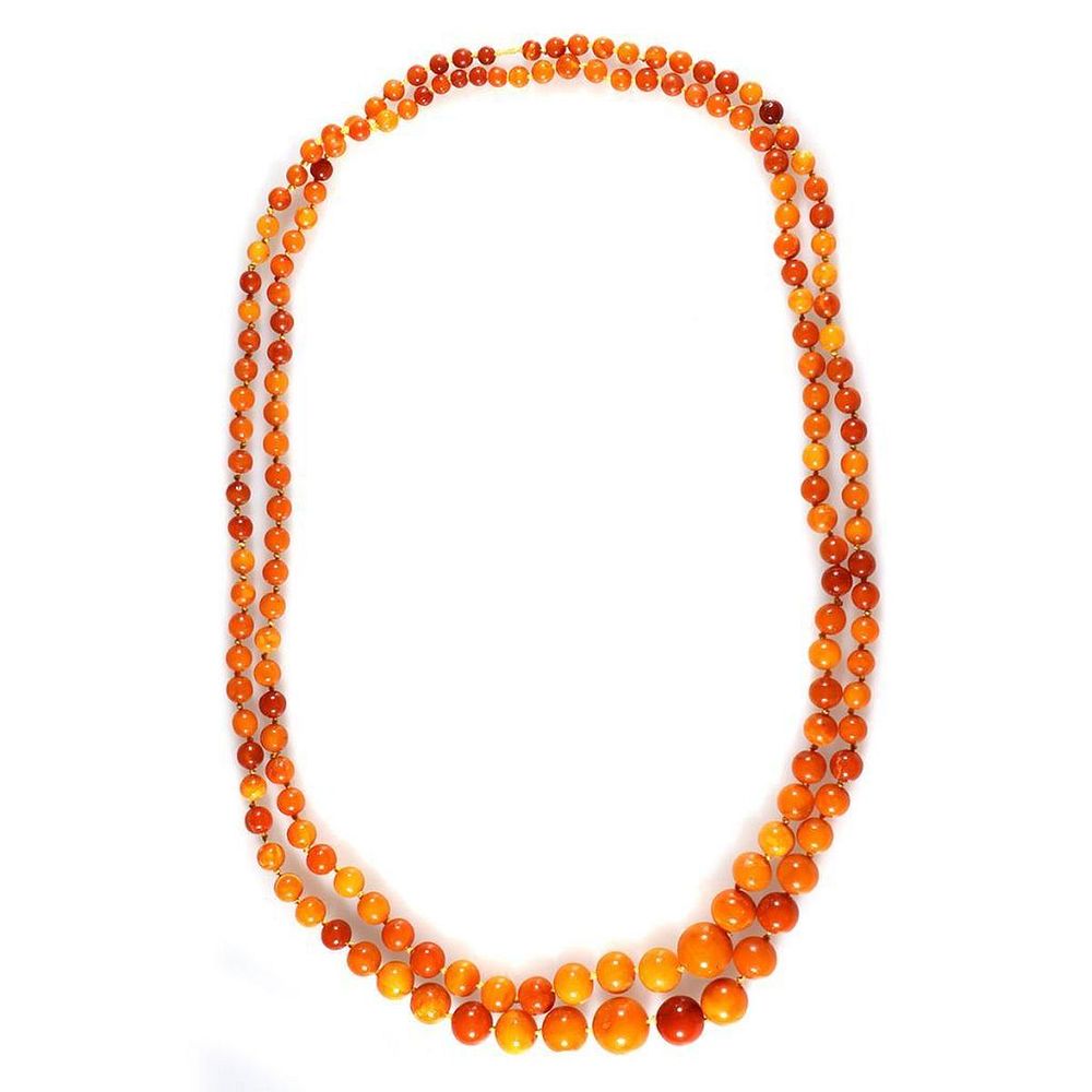 Appraisal: Amber bead 'flapper' necklace beads measuring approximately x mm some