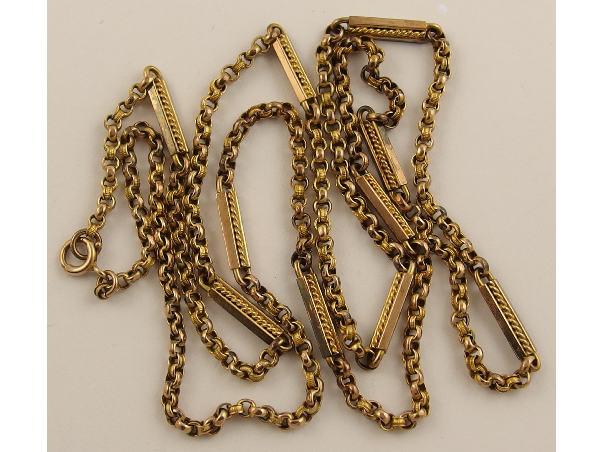 Appraisal: A decorative ct guard chainwith belcher shaped chain alternately facet