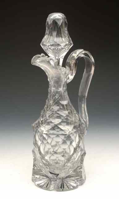 Appraisal: A GLASS DECANTER and stopper probably Irish of facet cut