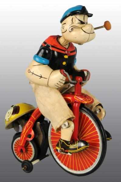 Appraisal: Tin Linemar Popeye on High Wheel Wind-Up Toy Description Japanese