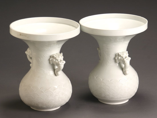 Appraisal: Pair of Japanese Carved White Glazed Porcelain Archaic Bronze-Form Vases