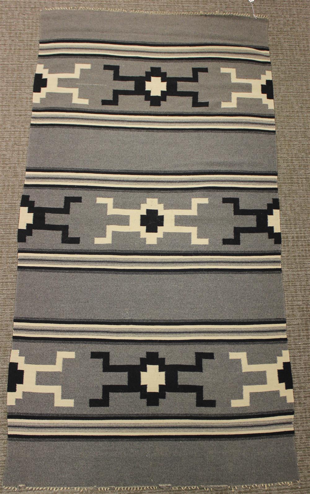 Appraisal: CHIMAYO WEAVING New Mexico black and white concentric crosses and