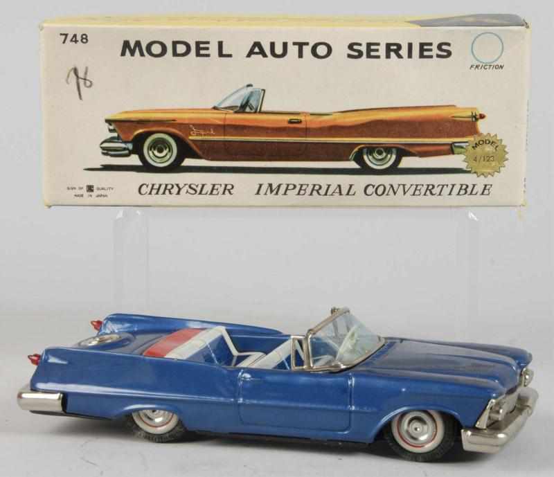 Appraisal: Tin Chrysler Imperial Convertible Friction Toy Description Japanese Working Made