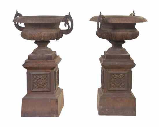 Appraisal: A Pair of Victorian Cast Iron Urns on Stands each