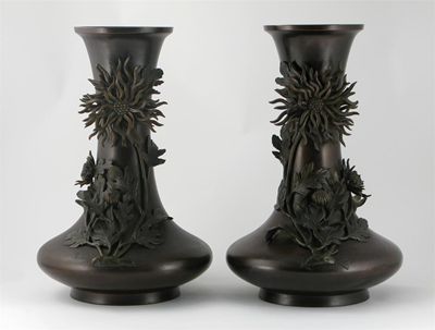 Appraisal: A pair of Japanese bronze vases applied in relief with