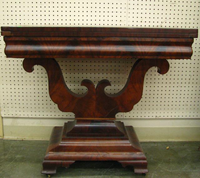 Appraisal: th Century Empire-style mahogany game table with crotch-cut mahogany veneer