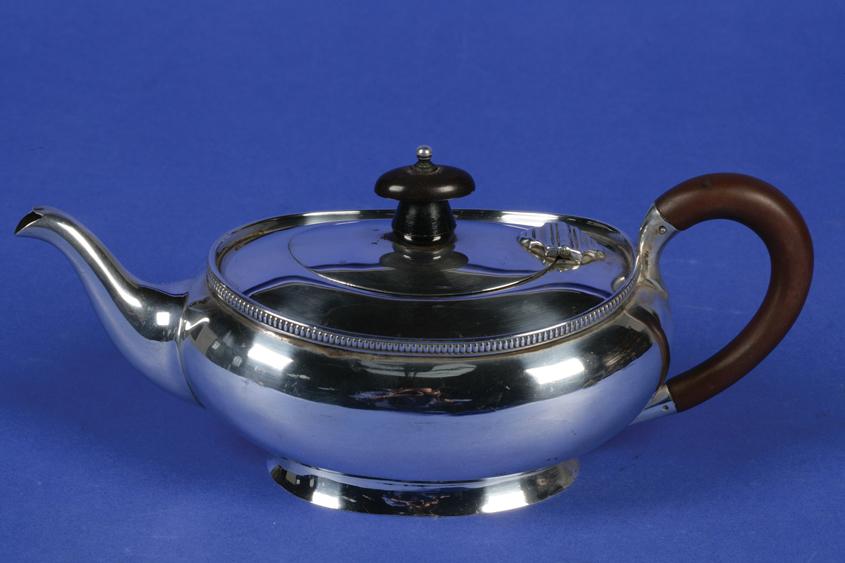 Appraisal: A TEAPOT of squat oval form with a flush hinged