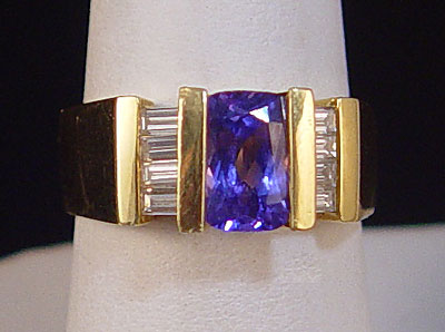 Appraisal: K TANZANITE AND DIAMOND RING K yellow gold ring contains