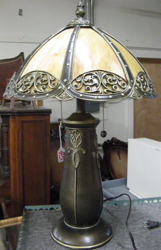 Appraisal: AN ART DECO STYLE TABLE LAMP The caramel slag bent