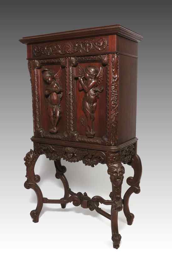 Appraisal: ITALIAN CARVED MAHOGANY MUSIC CABINET Early th century in the