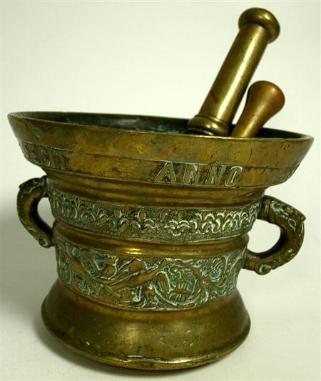 Appraisal: An early th century Flemish bronze mortar and two pestles