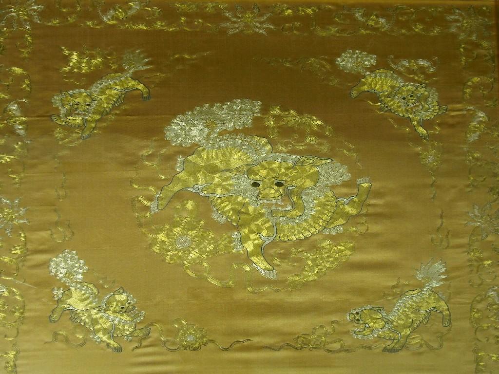 Appraisal: Oriental silkwork worked with gold and silver threads depicting mythical