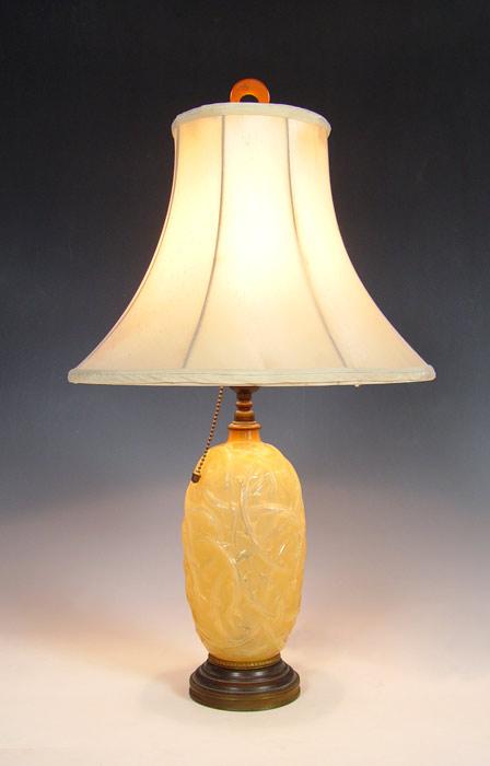 Appraisal: LALIQUE RONCES LAMP Amber color frosted glass in an interlacing