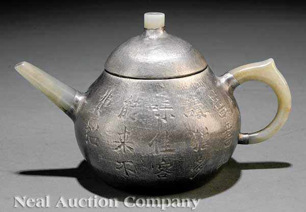 Appraisal: A Chinese Pewter Clad Yixing Pottery Teapot squat globular body