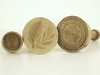 Appraisal: BUTTER STAMPS - Lot of three treenware th C butter