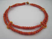 Appraisal: An antique coral necklace comprising two rows of faceted beads