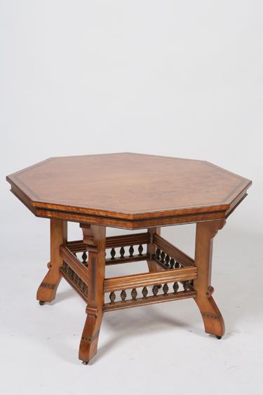 Appraisal: A VICTORIAN GOTHIC REVIVAL SATINWOOD CENTRE TABLE with an octagonal