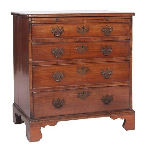 Appraisal: A GEORGE III MAHOGANY STRAIGHT FRONT CHEST of four long